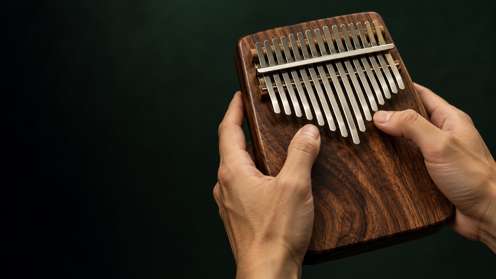 The natural wood and delicate steel keys of a kalimba